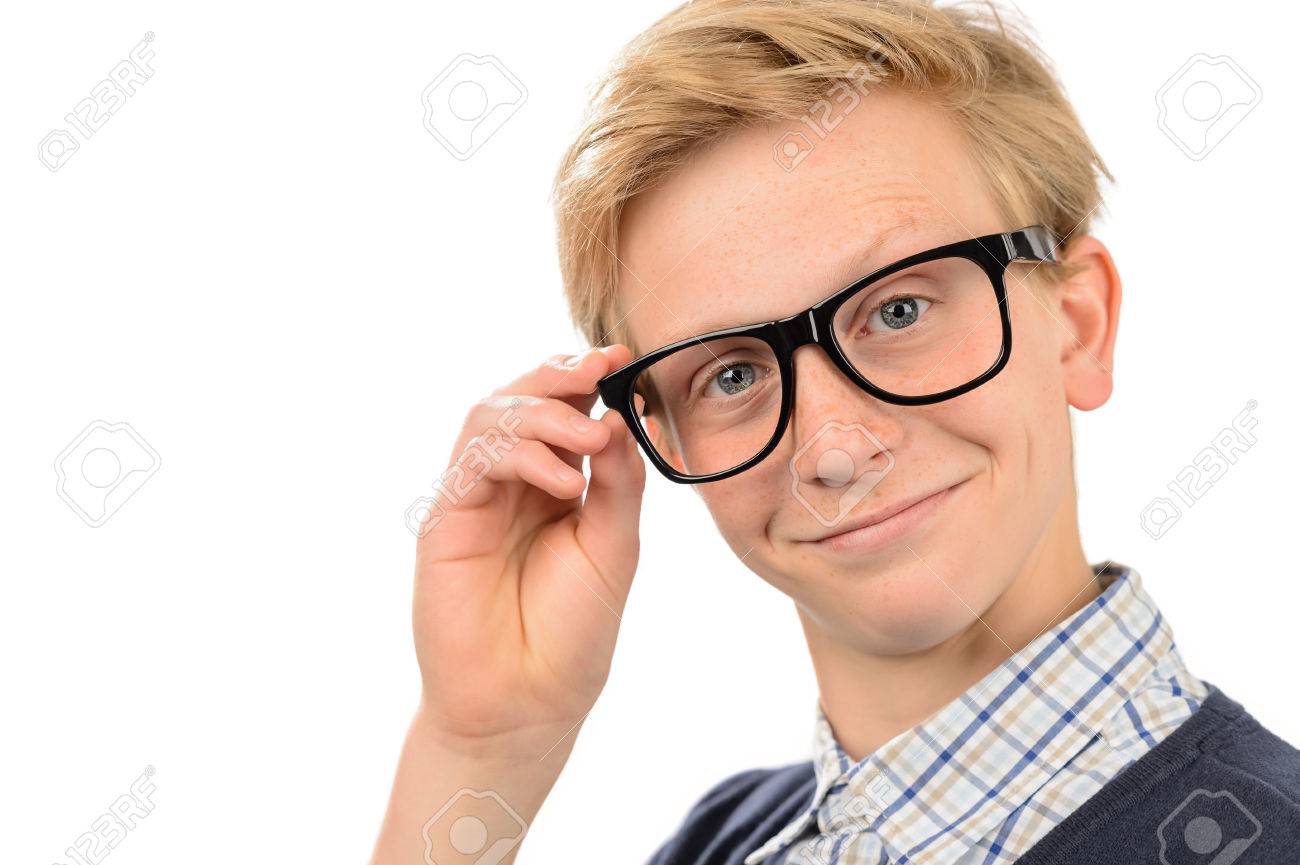 28631944-confident-teenage-nerd-boy-holding-geek-glasses-against-white-background.jpg
